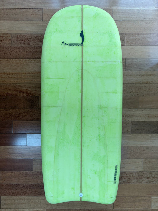 A lime green bodyboard with a black Matt Boards logo and text near the tail that says Made of 100% Upcycled Foam, laid flat on a wooden floor.