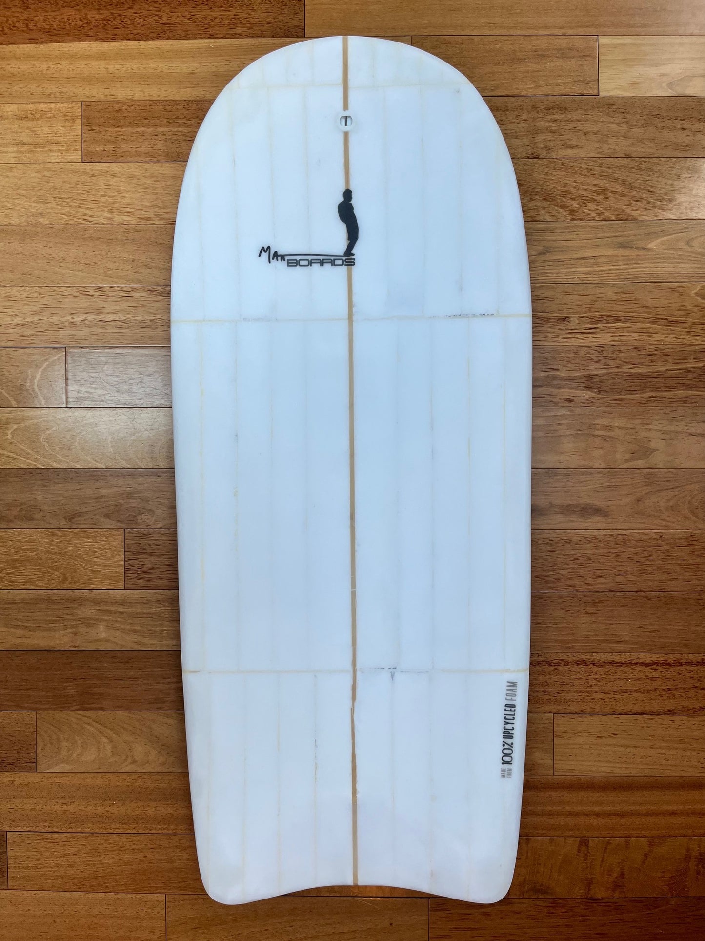 White body board with black Matt Boards logo on a wooden background