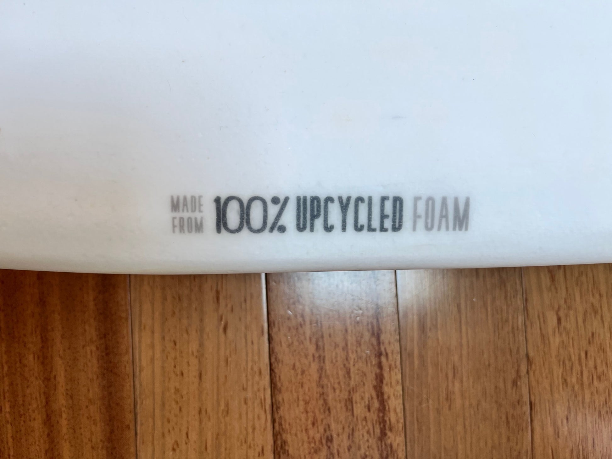 Label indicating 'Made from 100% upcycled foam' on a white background.